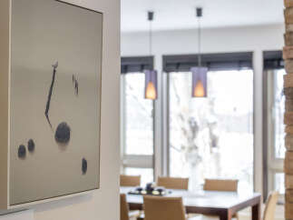 This stunning property features a modern dining area with elegant pendant lighting and comfortable seating, perfect for hosting gatherings.