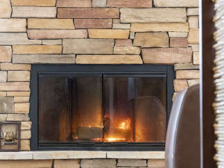 Cozy up by the fire in this stunning home featuring a beautiful stone fireplace.