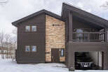 Experience luxury mountain living in this stunning modern chalet, perfect for a winter getaway.