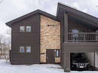 Experience luxury mountain living in this stunning modern chalet, perfect for a winter getaway.