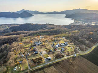 Discover this charming rural property nestled amidst rolling hills and overlooking a serene lake.
