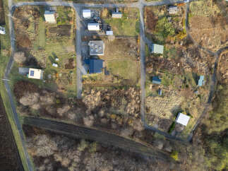 Discover this charming rural property featuring a collection of houses and outbuildings nestled amidst natural landscapes.