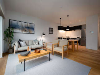 Experience modern living in this beautifully appointed apartment, featuring a spacious open-plan living and dining area perfect for entertaining.