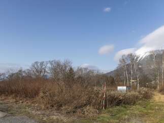 Discover this scenic property with a backdrop of snow-capped mountains and clear blue skies.