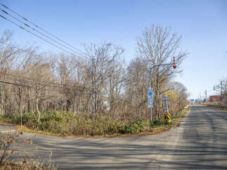 Discover a serene escape with this property, nestled amidst a tranquil wooded landscape.