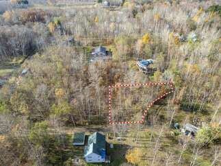 Discover this expansive wooded lot, perfect for building your dream home or a private retreat.