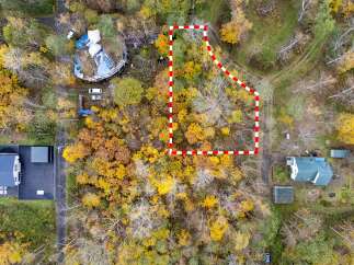 Discover this unique property nestled amidst a vibrant autumn forest.