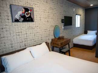 This stylish room features two comfortable beds, perfect for accommodating guests or family.