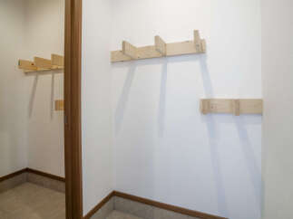 This entryway features a convenient wall-mounted coat rack, perfect for organizing outerwear.