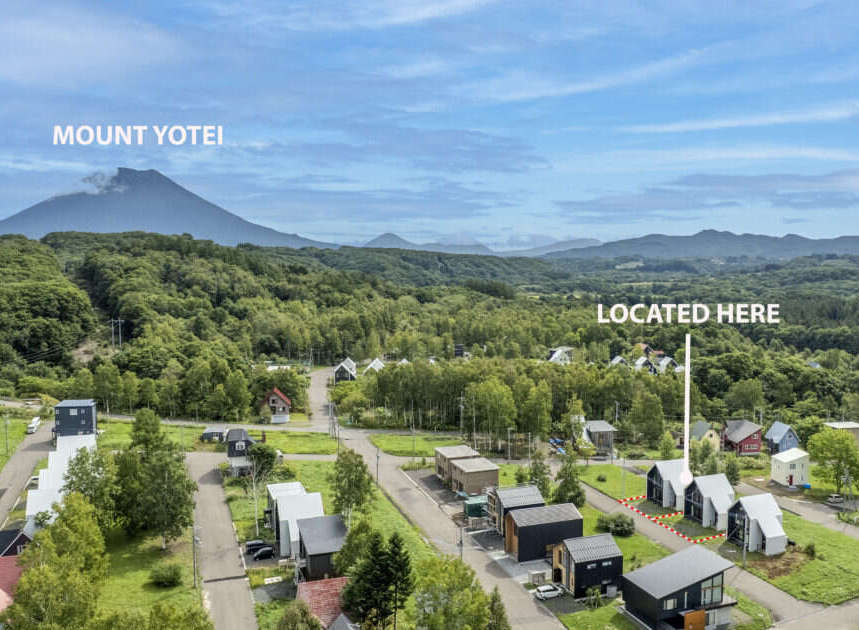 Discover your dream home nestled amidst lush greenery with a stunning view of Mount Yotei.
