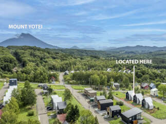 Discover your dream home nestled amidst lush greenery with a stunning view of Mount Yotei.