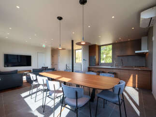 Experience modern living in this spacious open-concept home, featuring a sleek kitchen with ample cabinetry and a large island perfect for entertaining.