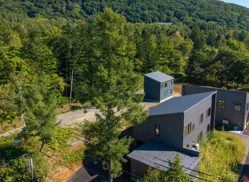 Discover modern living nestled amidst lush greenery.