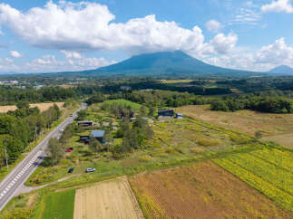 Discover this stunning property nestled in a serene rural landscape, offering breathtaking views of a majestic mountain.