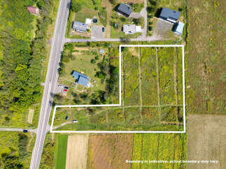 Discover this expansive parcel of land, perfect for development or agricultural pursuits.