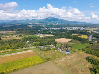 Discover this stunning aerial view of a sprawling rural landscape, perfect for those seeking tranquility and space.