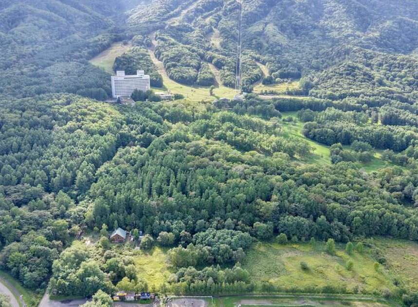 Discover this expansive property nestled amidst lush greenery and rolling hills, offering a serene escape.