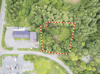 Discover this prime parcel of land, perfectly situated for development and surrounded by lush greenery.