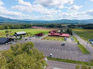 Discover this expansive property featuring a large, well-maintained parking lot, ideal for commercial use or visitor access.