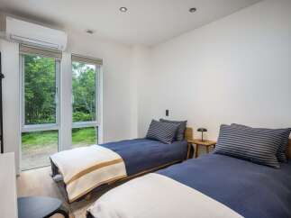 This charming bedroom features two twin beds, perfect for accommodating guests or family.