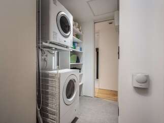 Discover efficient living with this stacked washer and dryer unit, perfect for maximizing space in your laundry area.