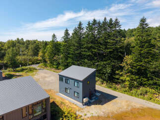 Discover modern living nestled amidst lush greenery with this stunning property.