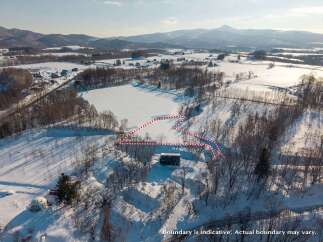 Discover this expansive winter wonderland property, perfect for those seeking tranquility and natural beauty.
