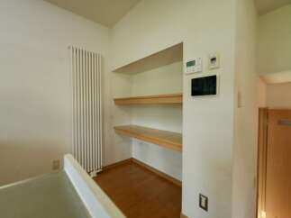 This image showcases a clean and organized space featuring built-in shelving, perfect for storage or display.