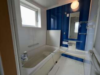 Discover this clean and functional bathroom featuring a deep soaking tub, perfect for relaxation.
