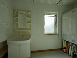 Discover a functional bathroom space featuring a clean white vanity with a sink and ample storage below.