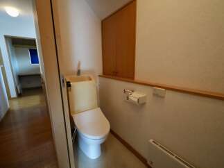 This bathroom features a modern toilet with an integrated sink, perfect for small spaces.