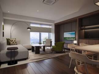 Experience modern living in this beautifully designed apartment, featuring a spacious living area with a comfortable sectional sofa and a stylish accent chair.