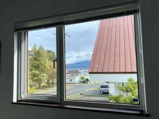 Enjoy scenic views from this charming property, featuring large windows that flood the space with natural light.