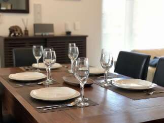 Experience elegant dining in this beautifully set table, perfect for hosting.