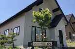Discover this charming property featuring a modern exterior with clean lines and a dark roof.