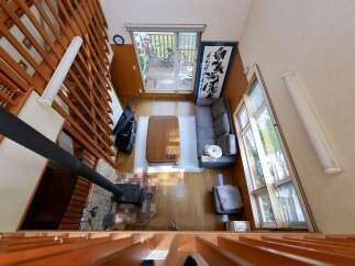 Experience cozy living in this charming home featuring a rustic wood-burning stove and a spacious open-concept living area.