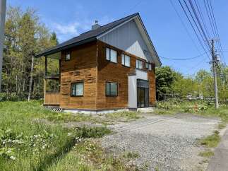 Discover this charming wooden house nestled amidst lush greenery, perfect for a serene getaway.