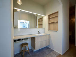 This modern bathroom vanity features a sleek design with a large mirror and integrated lighting, perfect for any contemporary home.