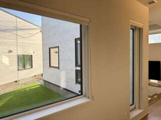 Experience modern living with this stunning property featuring large windows that flood the space with natural light.