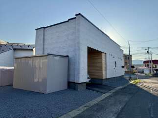 Discover modern living in this stunning property featuring a sleek, contemporary facade with light grey textured siding.