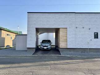 Discover modern living in this stunning property featuring a sleek, contemporary design with a covered carport for your vehicle.