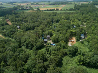 Discover a unique property nestled within a lush forest, offering a serene escape.