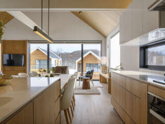 Experience modern living in this stunning home featuring a spacious open-concept living and dining area with vaulted ceilings and abundant natural light.