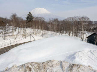 Experience the serene beauty of a winter wonderland with this stunning property nestled amidst snow-covered landscapes.