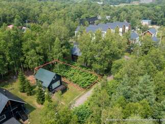 Discover this charming property nestled amidst lush greenery, offering a serene escape.