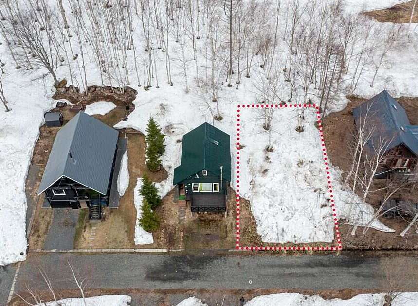 Discover this charming property nestled amongst snow-dusted trees, offering a serene winter retreat.