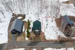 Discover this charming property nestled amongst snow-dusted trees, offering a serene winter retreat.