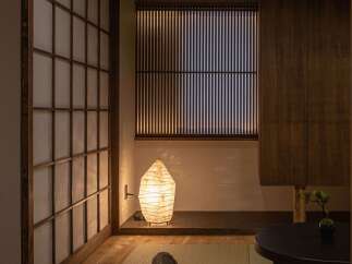 Experience serene living in this Japanese-inspired room, featuring traditional tatami flooring and shoji screens that diffuse soft, natural light.