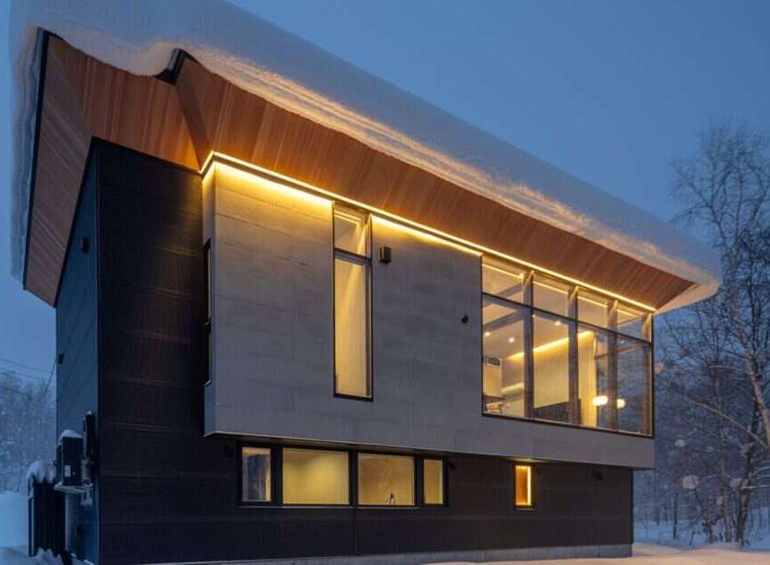 Experience modern luxury in this stunning architectural home, nestled in a serene, snow-covered landscape.