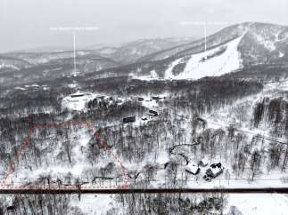 Discover this prime real estate opportunity nestled in a serene, snow-covered landscape.